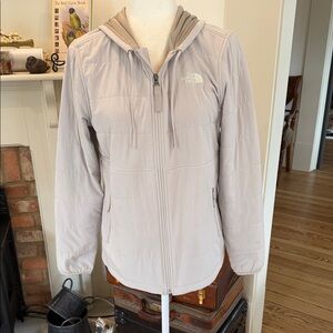 The North Face women's hooded soft shell in a light gray color.  Size M